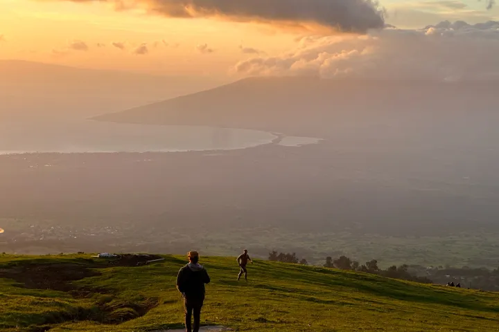 a man flying a kite in a field