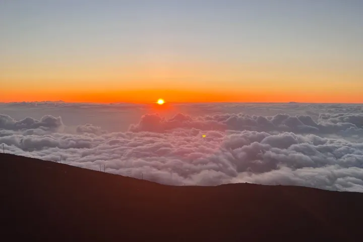 a sunset over clouds