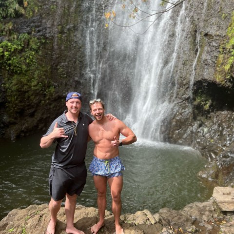 Andy Ciarniello standing next to a waterfall