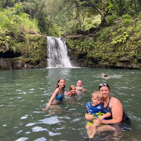a group of people swimming in a body of water