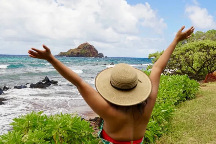 a person standing in front of a body of water