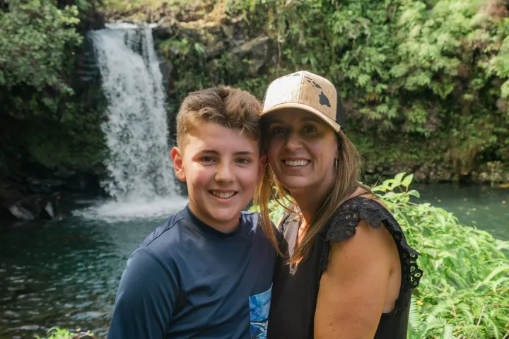 a person standing next to a body of water