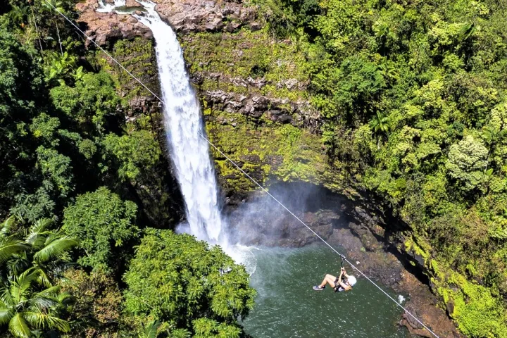 a large waterfall in a forest